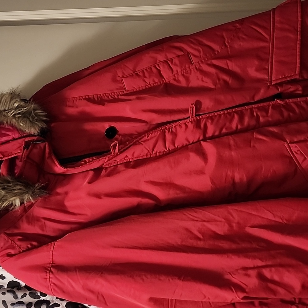 A red winter coat with fur  hood brand is Ellos  4x